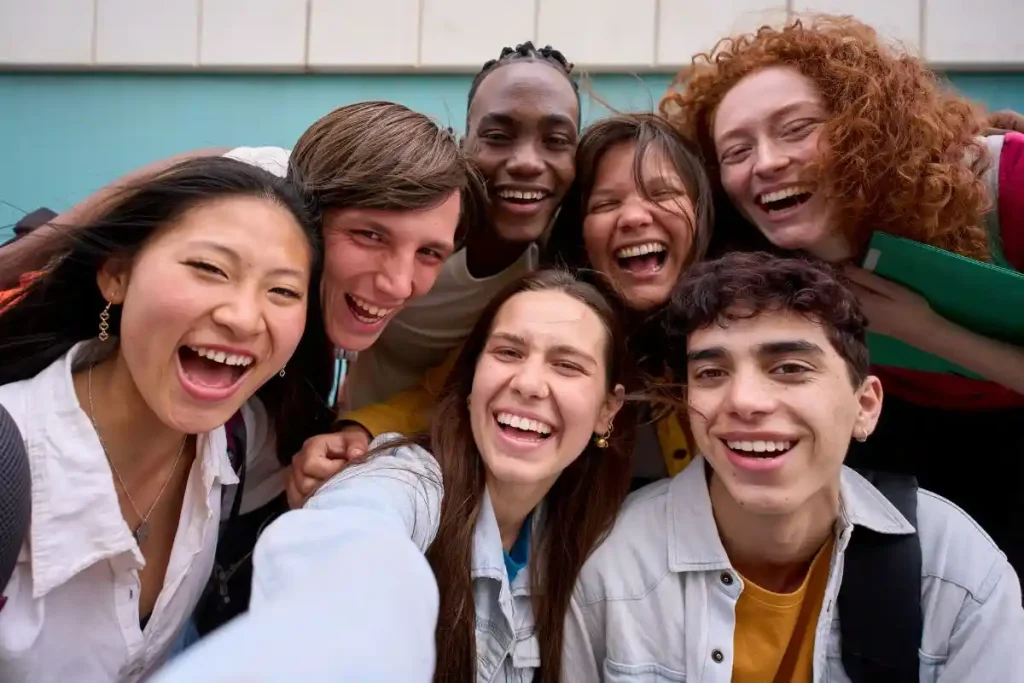 Diverse group of Erasmus students in Malta smiling together – student social life abroad