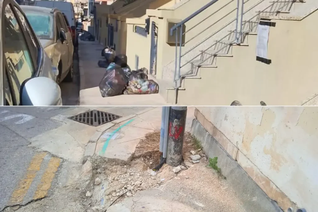 A pavement blocked by rubbish and fixed obstacles, leaving no continuous route and forcing anyone with a stroller into the road.