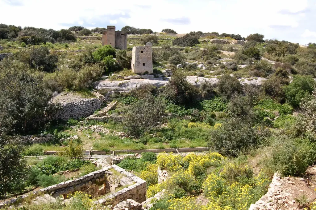 landscape near Għar Dalam with historic tower and World War II bunker